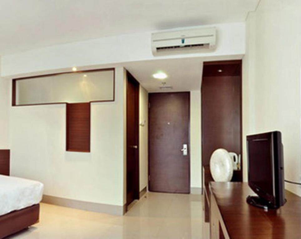 Bamboo Inn Hotel & Cafe Джакарта Номер фото